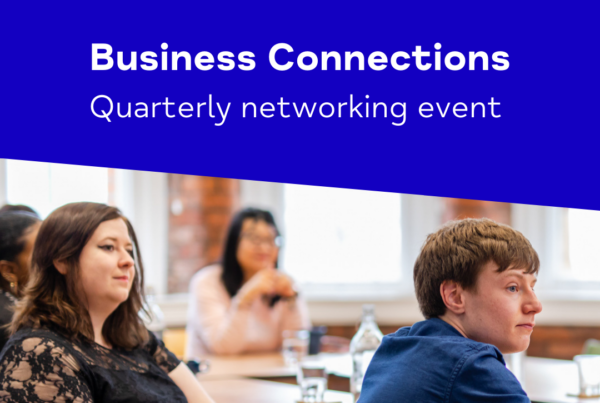 Two people sat in a talk, with the words Business Connections Quarterly Networking Event above on a blue background