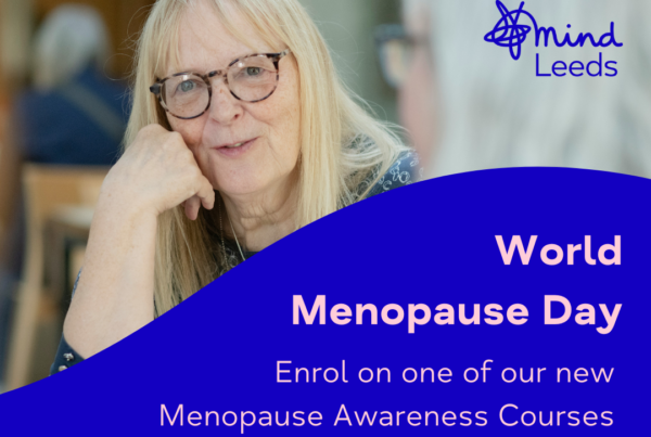 Woman in conversation with text reading World Menopause Day, Enrol on one of our new menopause awareness courses on blue background