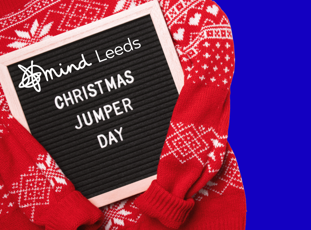 Christmas jumper and text board reading 'christmas jumper day, with Leeds Mind logo